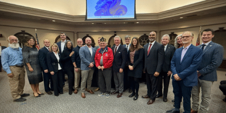 Mayor and Council celebrate the news with Roswell Veterans.