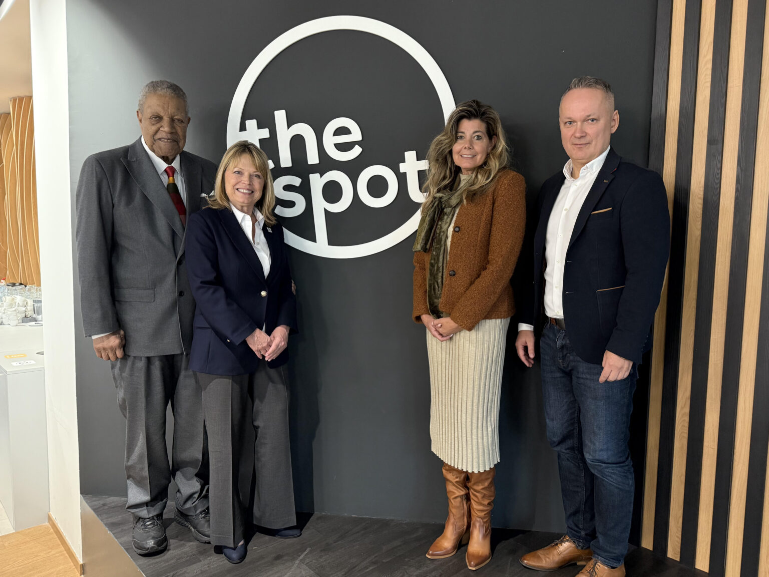 Roswell Returns to Czech Republic, Expands Trade Mission Across Europe City and state officials pose in front of a sign that say, "The Spot."